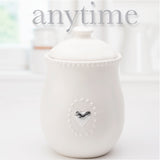 White Ceramic Canister w/Lid and  5 Interchangeable Metal Seasonal/Decor Magnets.