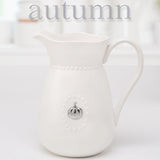 White Ceramic Water Pitcher w/Handle and 5 Interchangeable Metal Seasonal/Decor Magnets.