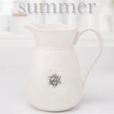 White Ceramic Water Pitcher w/Handle and 5 Interchangeable Metal Seasonal/Decor Magnets.